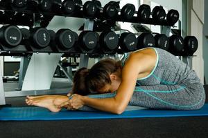 Sporty woman during her training in the gym photo