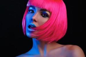 Potrait of young woman with pink hair photo