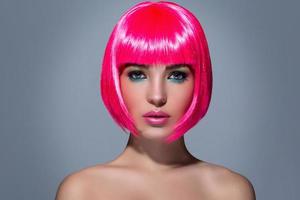 Potrait of young woman with pink hair photo