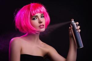 Potrait of young woman with pink hair photo