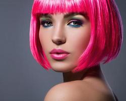 Potrait of young woman with pink hair photo