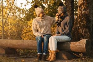 Young and happy couple in the autumn park photo