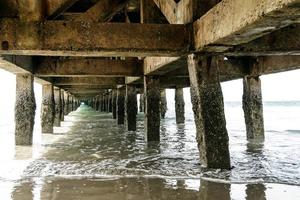 View of sea under the old pier photo