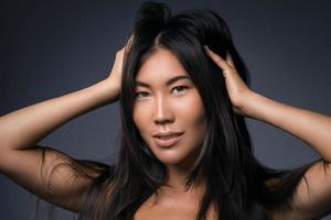 Young asian woman with straight black hair photo