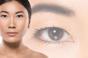 Woman and eye on background. Medical or beauty concept. photo