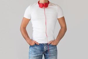 Man with red headphones on his neck photo