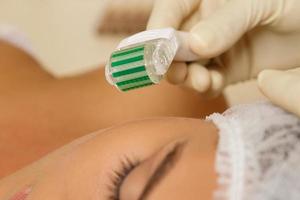 Woman in beauty salon during mesotherapy procedure. photo