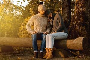 Young and happy couple in the autumn park photo