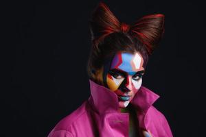 Model with a creative pop art make-up on her face photo