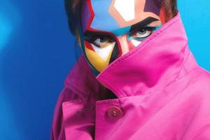 Model with a creative pop art make-up on her face photo