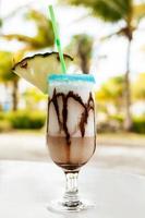 Pina colada cocktail with chocolate syrup