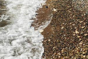 Background of pebbles stones on the beach photo