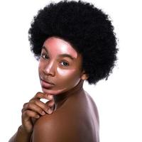 Young African woman with a purifying mask on her face photo