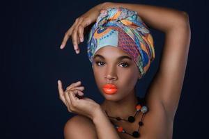 African woman with a colorful shawl on her head photo