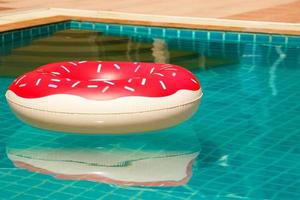 Inflatable swim ring in shape of donut photo