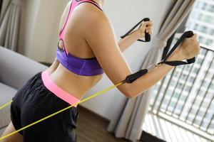 Home workout with a rubber resistance bands photo