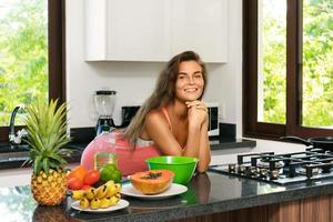 Woman housewife during cooking process in the kitchen photo