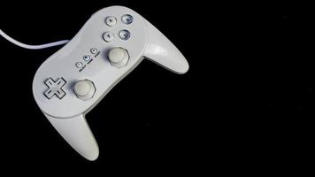 white joystick isolated black background photo