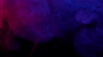 Smoke from Ultrasonic Aroma Diffuser and colorful light on black background. video