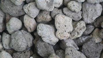 textura superficial detallada de un montón de piedra pómez como fondo foto