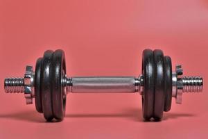 Set of weights isolated on pink background photo