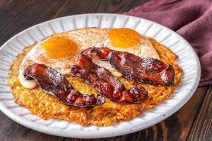 Hash brown with egg and bacon photo