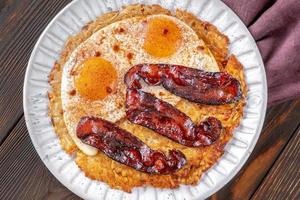 Hash brown with egg and bacon photo