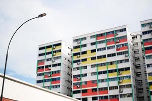 low angle view of signapore residential buildings against blue sky photo