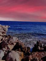 full moon on red sea and mountains photo