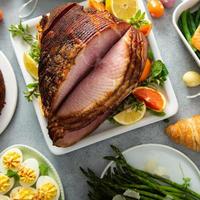 Easter brunch with spiral cut ham and roasted salmon photo