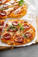 Flatbread pepperoni pizza with basil photo