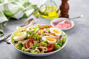 Spring vegetable salad with boiled eggs photo