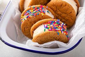 Ice cream and cookies sandwiches stacked on the table photo