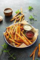 Sweet potato fries with sauces photo