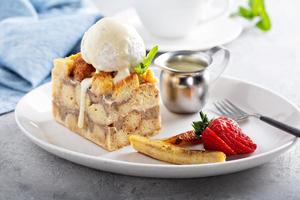 Warm apple bread pudding with ice cream photo