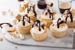 Smores cupcakes with graham crackers, toasted marshmallows and chocolate photo