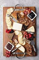 Cheese board with honey and crackers photo