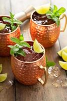 Traditional Moscow Mule in classic copper mugs photo