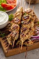 Greek chicken souvlaki with tzatziki photo