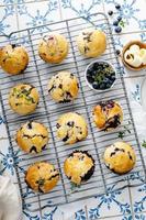 Blueberry muffins with fresh berries and preserves photo