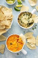 Artichoke spinach and buffalo chicken dips with chips photo