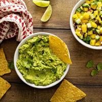 Tortilla chips with dips, guacamole and salsa photo