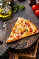 Hawaiian pizza with pineapple, ham and pepper photo