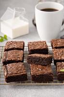 Homemade fudgy brownies on a baking rack photo