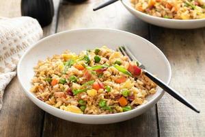 Breakfast fried rice with bacon and scrambled eggs photo