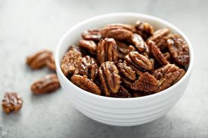 Caramelized or candied pecans photo