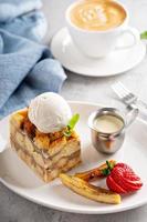 Warm apple bread pudding with ice cream photo