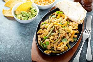 Chicken and bell peppers fajitas photo