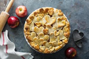 Apple pie topped with hearts photo