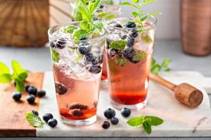 Blueberry mojito in tall glasses with mint photo